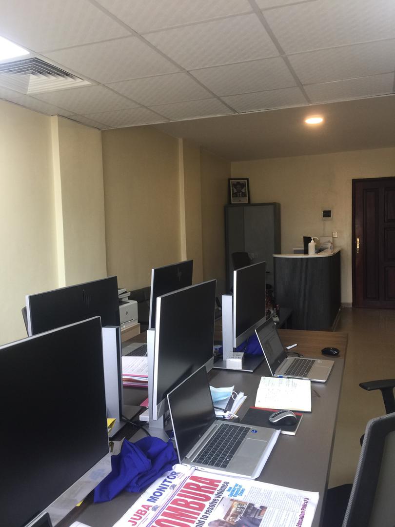 Team reviewing a completed project on screens